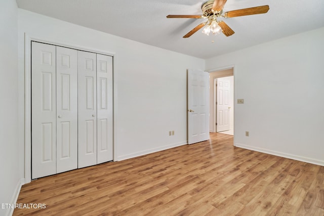 11 Windsor Pt, Crossville, TN 38558 - unfurnished bedroom with a closet, baseboards, ceiling fan, and light wood-type flooring