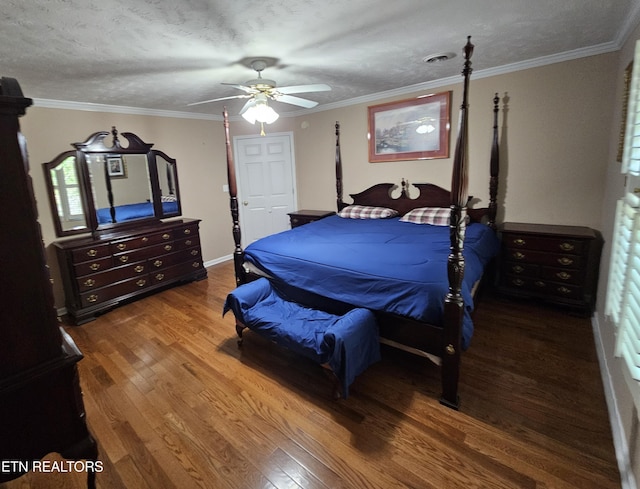 bedroom featuring crown molding, a ceiling fan, and wood finished floors