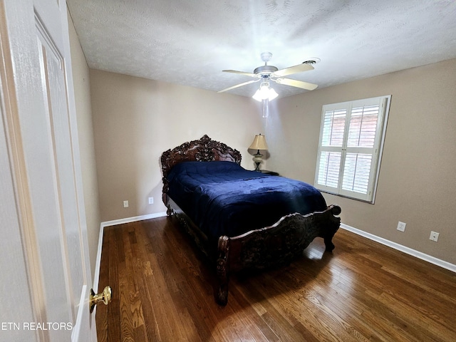 bedroom with baseboards, a ceiling fan, and hardwood / wood-style floors