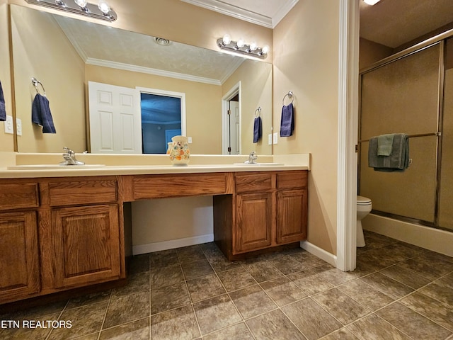full bath with a shower stall, toilet, ornamental molding, and a sink