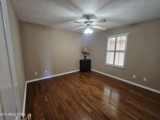 135 Creekwood Way Unit 118, Seymour, TN 37865 - empty room featuring dark wood-type flooring, ceiling fan, and baseboards