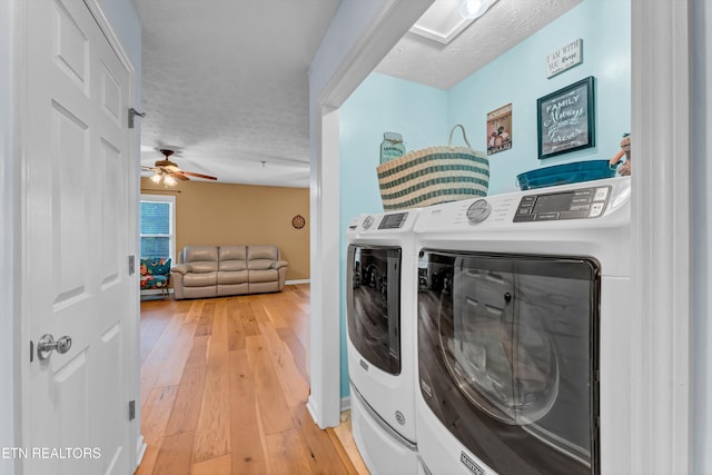 laundry room with washer and clothes dryer, laundry area, a textured ceiling, and a ceiling fan