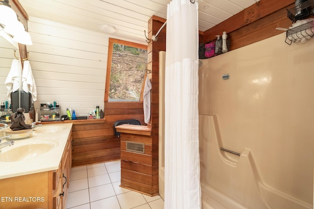 1122 Ski Mountain Rd, Gatlinburg, TN 37738 - bathroom with tile patterned floors, wooden walls, a sink, and double vanity