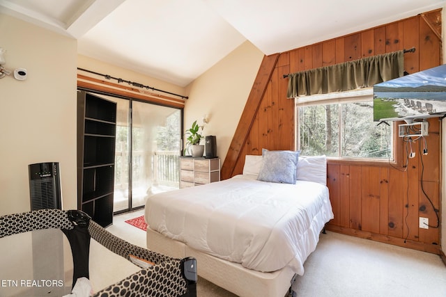 1122 Ski Mountain Rd, Gatlinburg, TN 37738 - bedroom with light colored carpet, wood walls, and access to outside