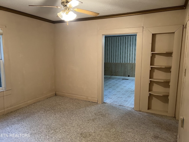 922 W Central Ave, Lafollette, TN 37766 - unfurnished room with carpet, a textured ceiling, ornamental molding, and ceiling fan