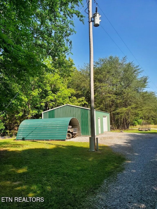 146 Sparkmantown Rd, Rock Island, TN 38581 - view of outbuilding featuring gravel driveway and an outbuilding