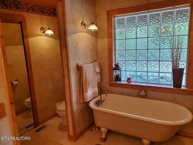 146 Sparkmantown Rd, Rock Island, TN 38581 - full bath with tile patterned floors, visible vents, baseboards, toilet, and a freestanding tub