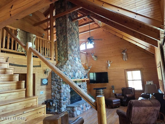 146 Sparkmantown Rd, Rock Island, TN 38581 - living room with wooden walls, high vaulted ceiling, wood finished floors, and stairs