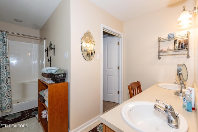 full bathroom with double vanity, a shower with shower curtain, and a sink