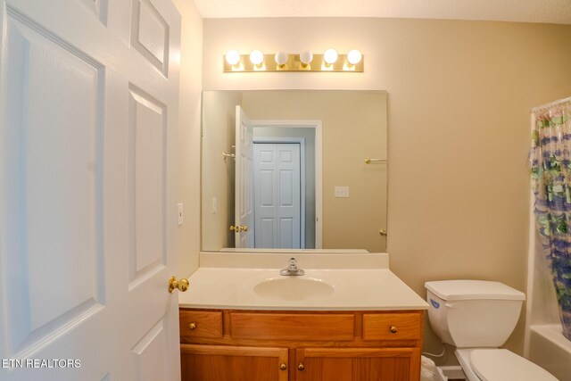 full bathroom featuring toilet and vanity