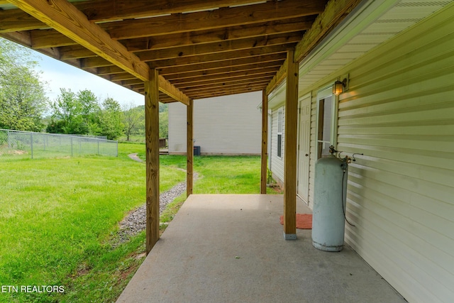 view of patio featuring fence