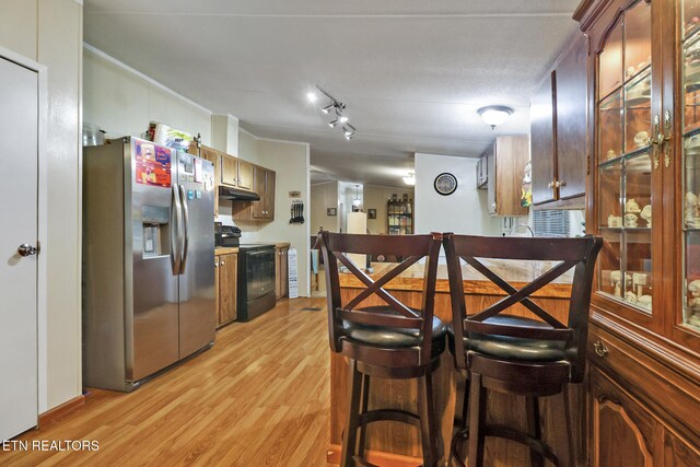 119 Sunset View Dr, Kingston, TN 37763 - kitchen featuring black electric range oven, stainless steel fridge, light wood-style floors, and under cabinet range hood