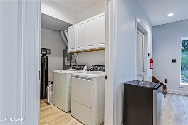 790 Pleasure Rd, Sevierville, TN 37876 - washroom with baseboards, recessed lighting, light wood-style floors, independent washer and dryer, and cabinet space