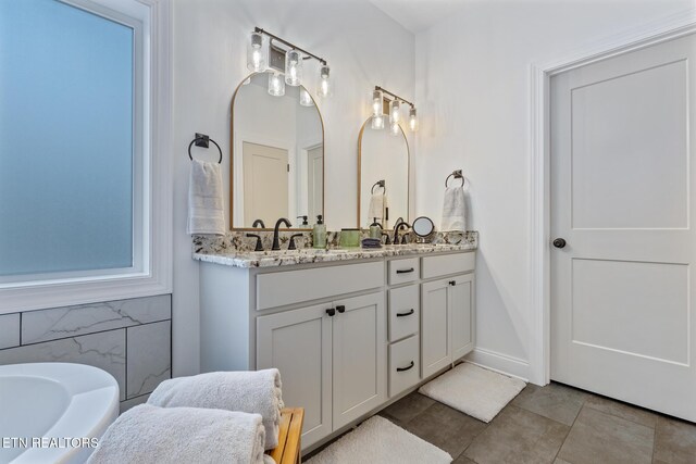 790 Pleasure Rd, Sevierville, TN 37876 - full bath with a tub to relax in, a sink, double vanity, and tile patterned floors