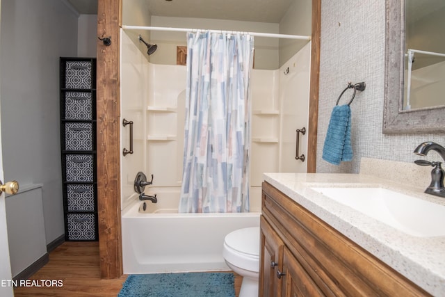 full bath with toilet, wood finished floors, shower / bath combo, and vanity