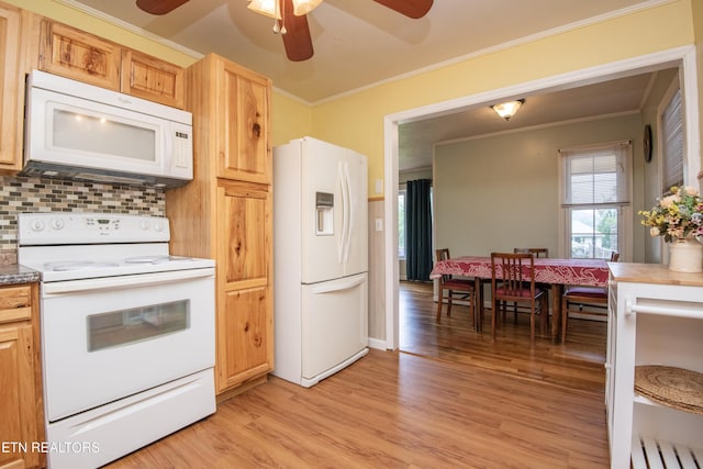 kitchen featuring ceiling fan, backsplash, crown molding, light wood finished floors, and white appliances