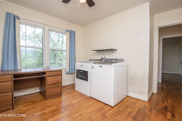 clothes washing area featuring washer and dryer, crown molding, light wood-style flooring, a ceiling fan, and baseboards