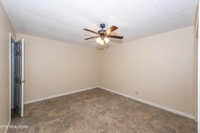 unfurnished room with baseboards, a textured ceiling, and ceiling fan
