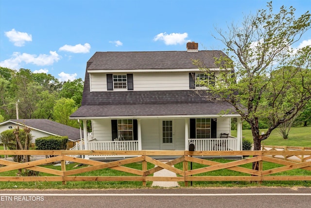 1921 Spring Hill Rd, Knoxville, TN 37914 - view of front facade with covered porch, a chimney, a shingled roof, and a fenced front yard