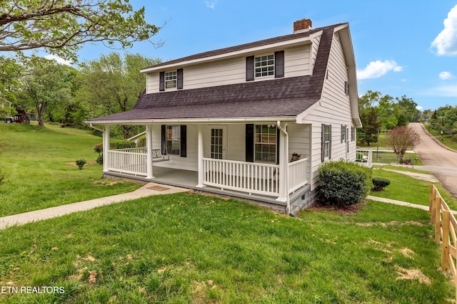1921 Spring Hill Rd, Knoxville, TN 37914 - view of front facade featuring a porch, a chimney, roof with shingles, and a front lawn