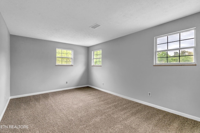 1921 Spring Hill Rd, Knoxville, TN 37914 - unfurnished room featuring carpet flooring, a textured ceiling, and baseboards