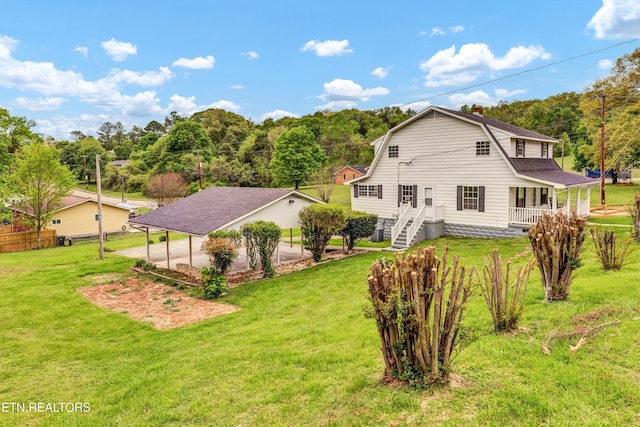 1921 Spring Hill Rd, Knoxville, TN 37914 - back of property featuring a gambrel roof, a lawn, and a chimney