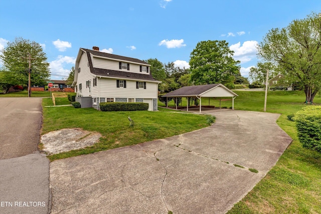 1921 Spring Hill Rd, Knoxville, TN 37914 - view of front of property featuring a carport, a chimney, a front lawn, and driveway