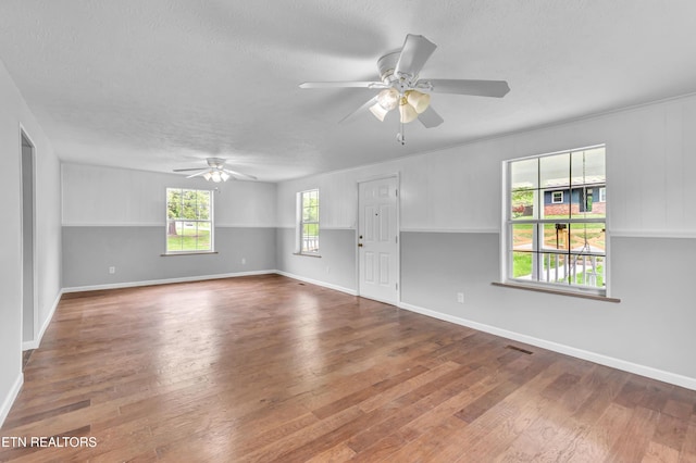 1921 Spring Hill Rd, Knoxville, TN 37914 - empty room with ceiling fan, wood finished floors, a textured ceiling, and baseboards