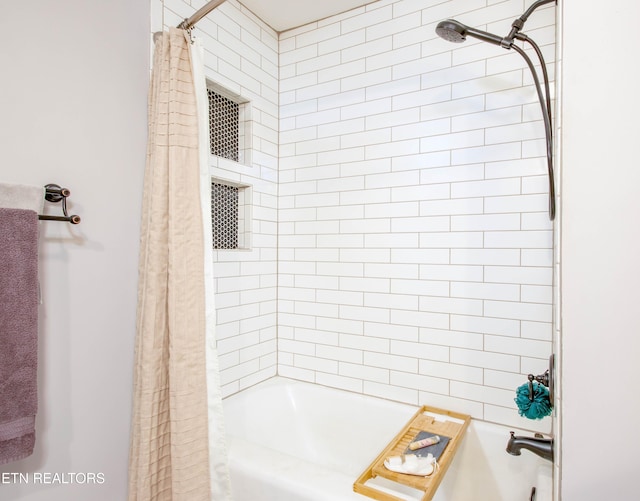 full bathroom featuring shower / bathtub combination with curtain