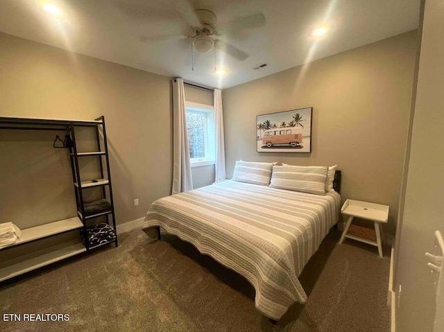 bedroom with carpet floors, visible vents, baseboards, and ceiling fan