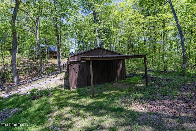4360 Lakeshore Ave, Sevierville, TN 37876 - view of shed featuring a forest view