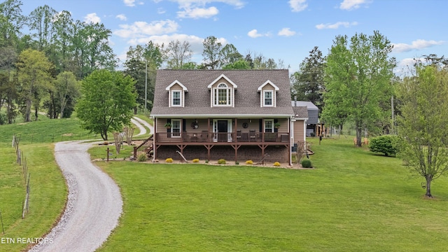 view of front of home featuring covered porch and a front yard