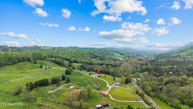 drone / aerial view with a rural view and a view of trees