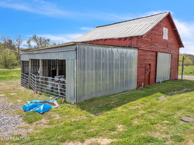 view of pole building with a yard
