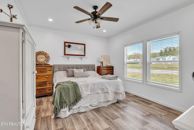 bedroom with recessed lighting, light wood finished floors, ornamental molding, baseboards, and ceiling fan