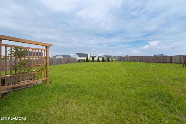 view of yard featuring fence
