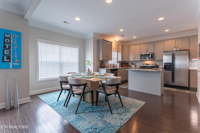 dining room featuring crown molding, visible vents, baseboards, recessed lighting, and dark wood-type flooring