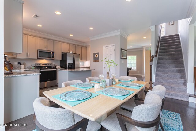 dining area with visible vents, recessed lighting, dark wood-style floors, stairway, and crown molding