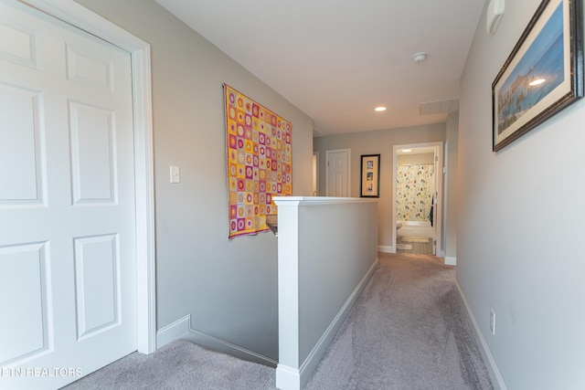 corridor with recessed lighting, an upstairs landing, carpet, and baseboards