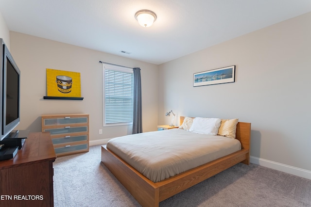 bedroom with visible vents, carpet floors, and baseboards
