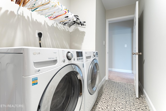 laundry room with independent washer and dryer, laundry area, and baseboards