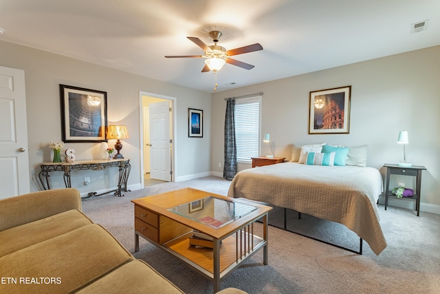 bedroom featuring visible vents, ceiling fan, light colored carpet, and baseboards