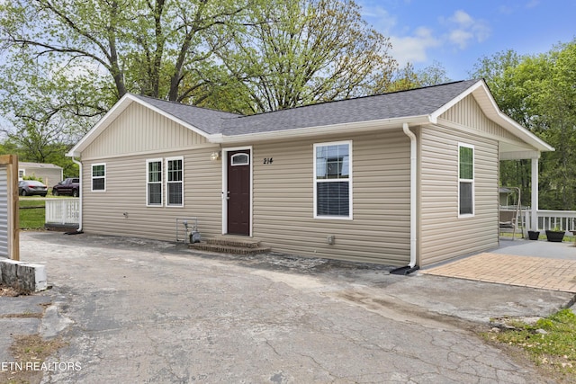 view of front of house with roof with shingles