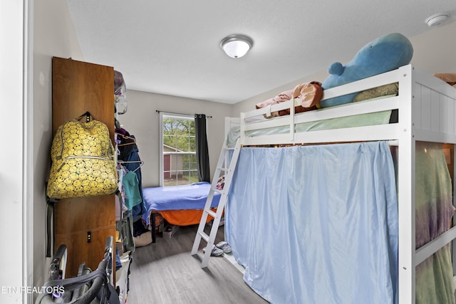 bedroom with wood finished floors