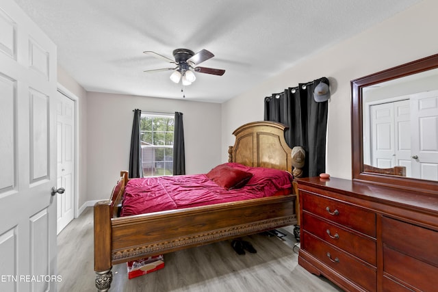 bedroom with ceiling fan and light wood finished floors