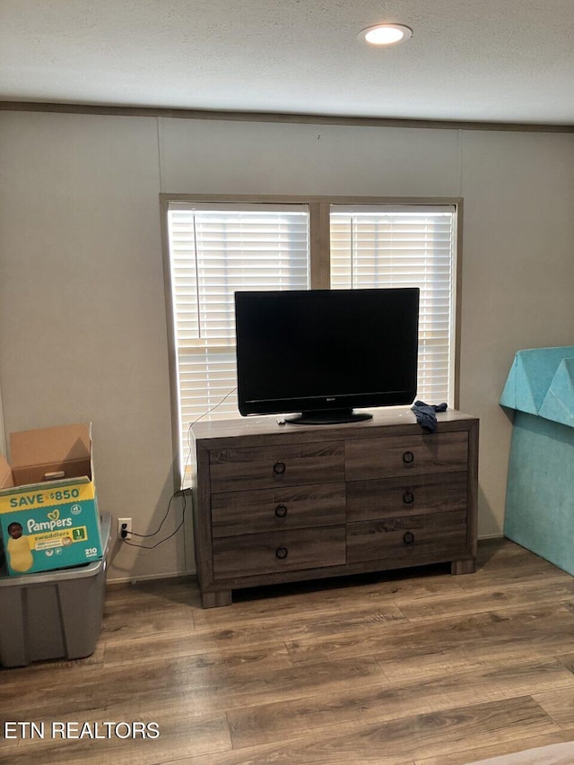 interior space featuring recessed lighting and wood finished floors