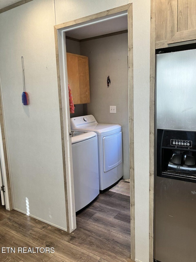 laundry area with cabinet space, dark wood-type flooring, and independent washer and dryer