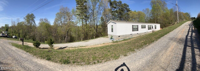 view of side of property with crawl space
