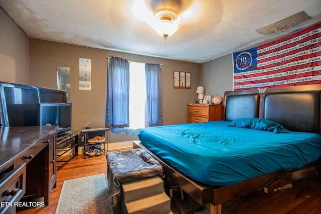 bedroom featuring wood finished floors