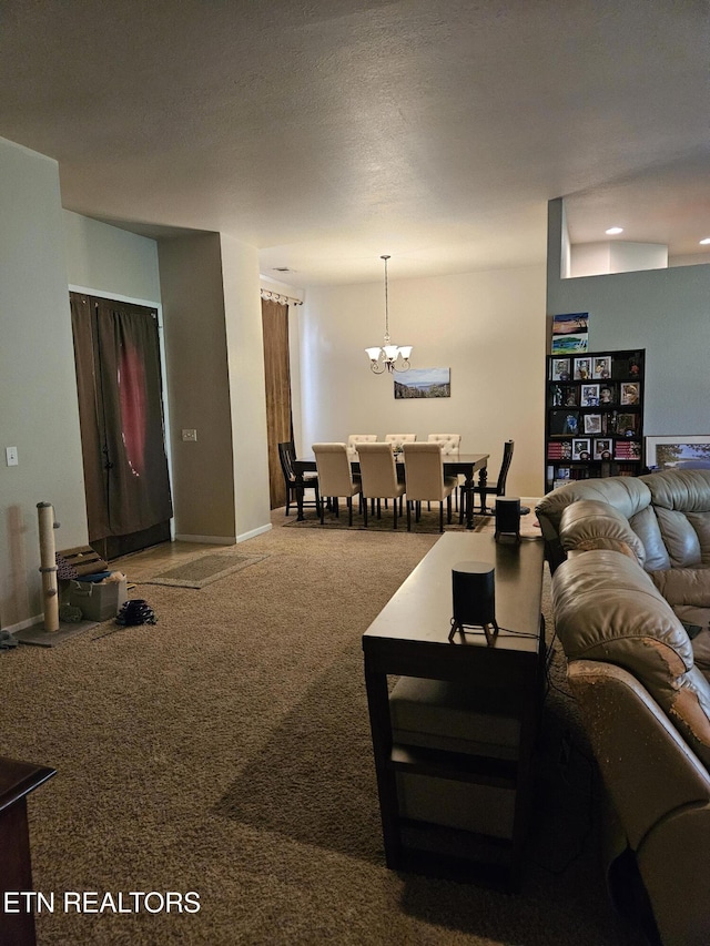 living room featuring baseboards, carpet, and a chandelier